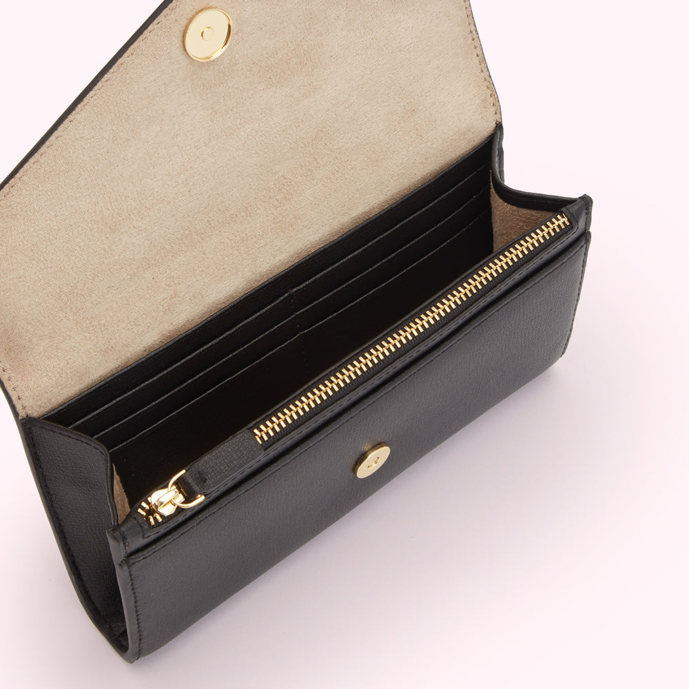 Open black leather wallet with beige interior and gold zipper.