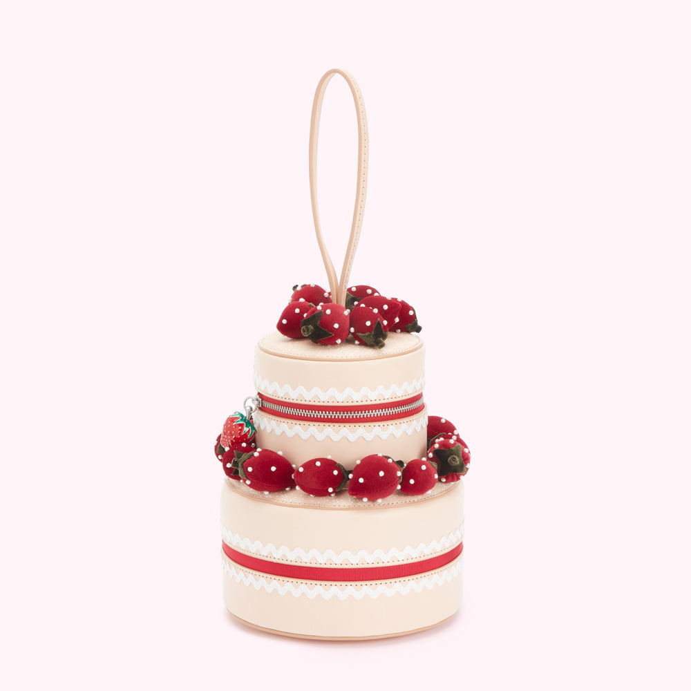 Beige leather two-tiered cake-shaped handbag decorated with red strawberries.