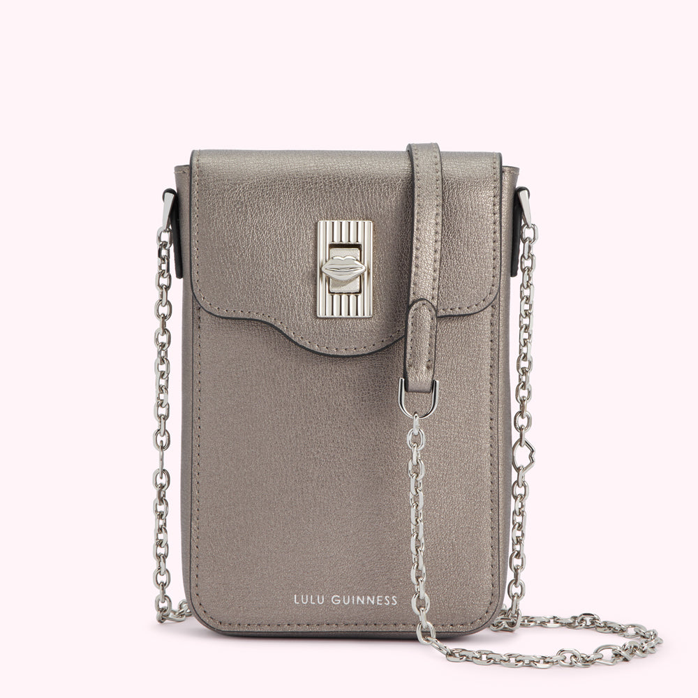 A silver Lulu Guinness crossbody bag with a lip-shaped clasp.
