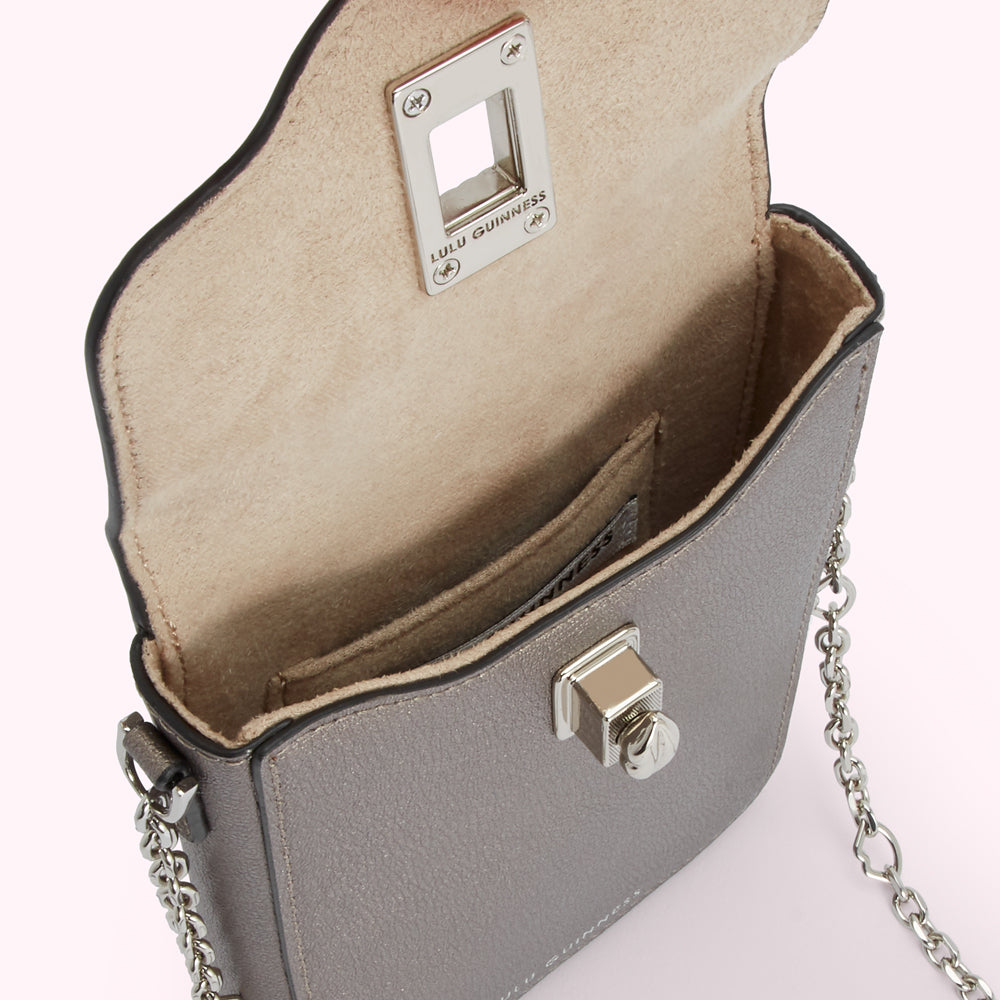Open grey Lulu Guinness crossbody bag with beige interior and silver chain strap.
