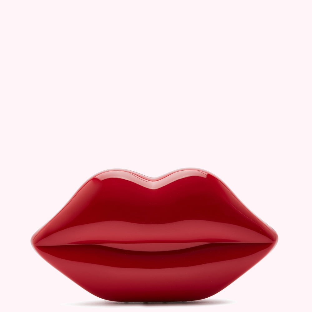 Red lips-shaped clutch bag on white background.