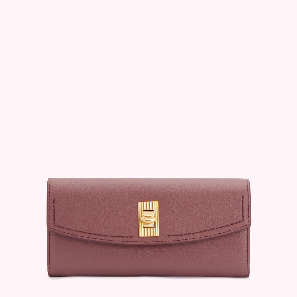 Dusty rose leather wallet with gold clasp.
