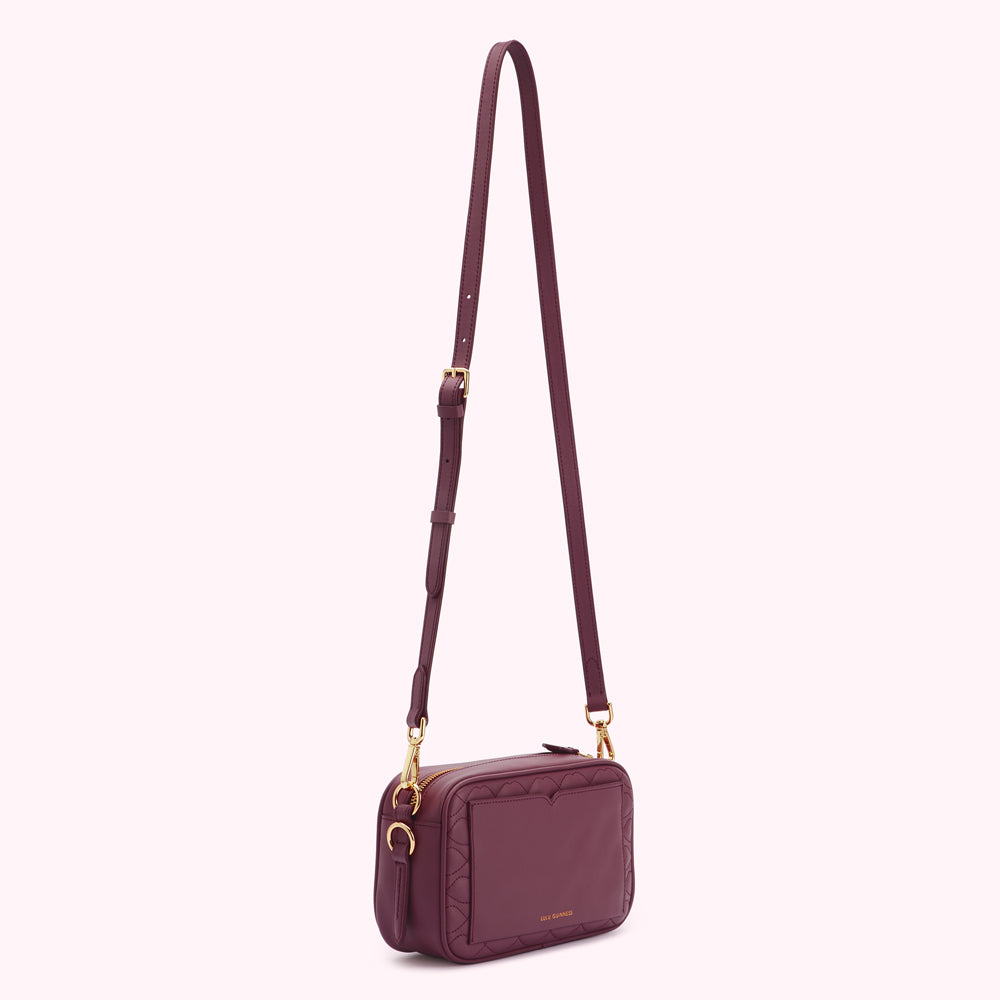 Burgundy quilted crossbody bag with gold hardware.