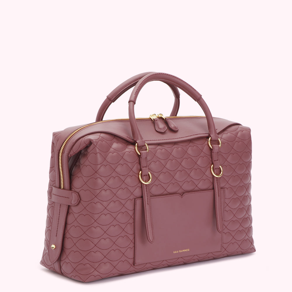 A mauve Lulu Guinness quilted heart-shaped handbag with gold-toned hardware.