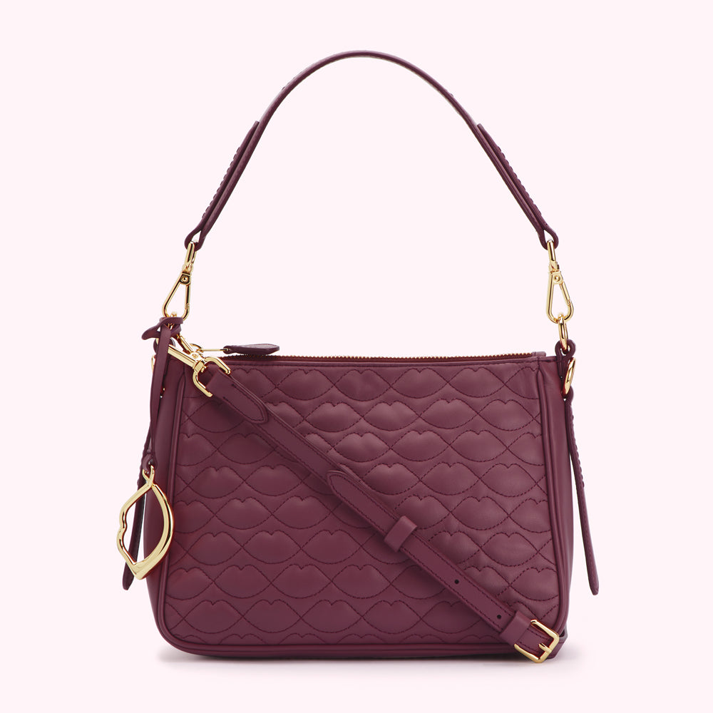 Burgundy quilted leather shoulder bag with gold hardware.