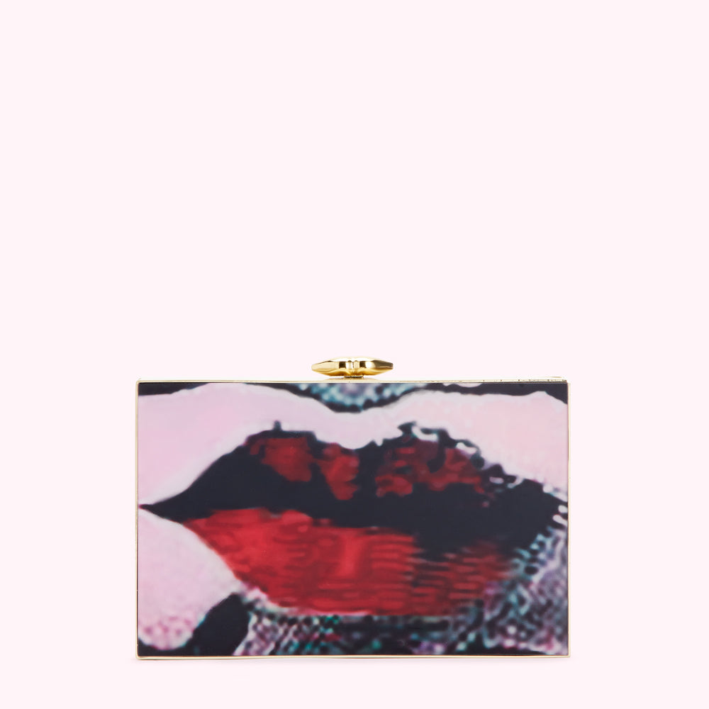 Square clutch with a gold clasp and an image of lips in shades of pink, red, and black.