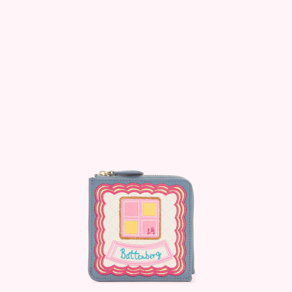 Dusty blue leather compact wallet with embroidered Battenburg cake design.
