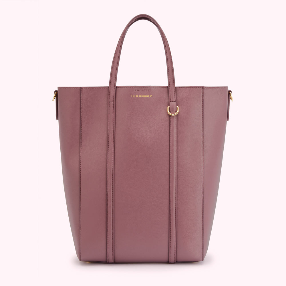 A dusty rose Lulu Guinness tote bag with gold-toned hardware.