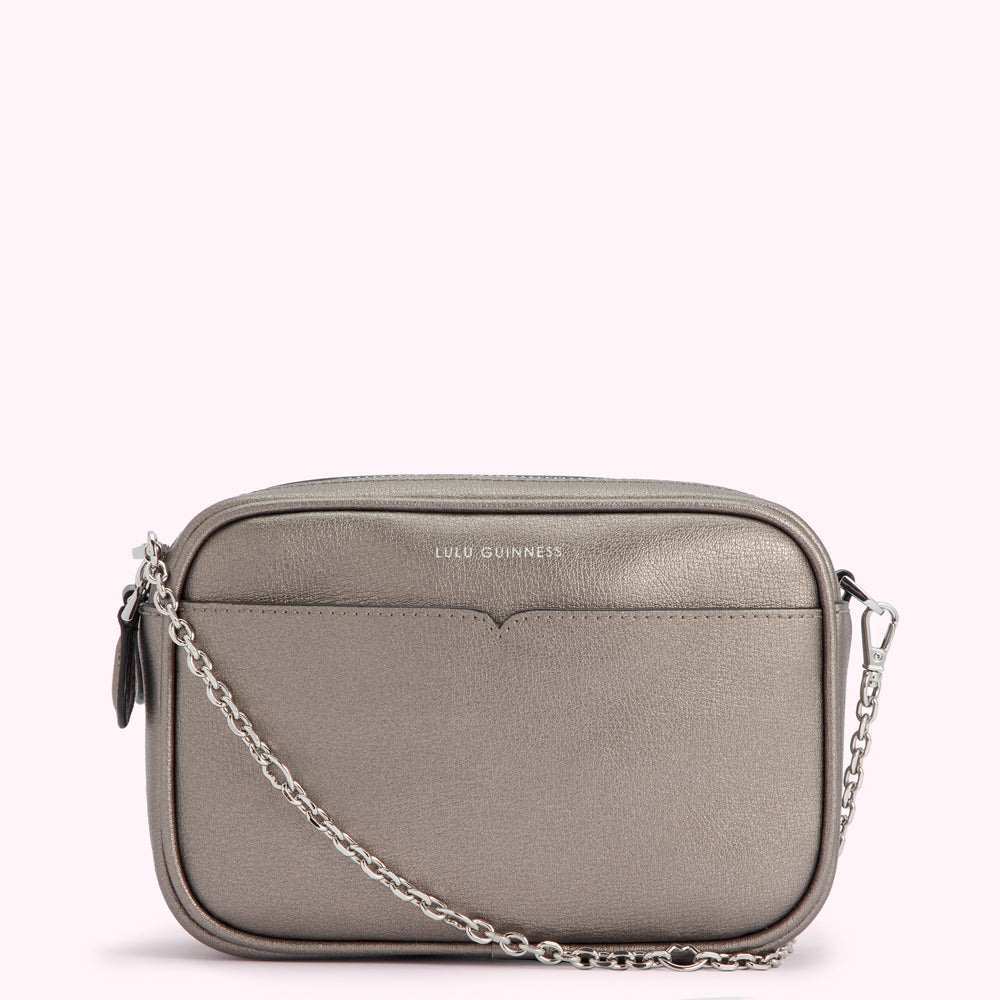 Silver Lulu Guinness crossbody bag with chain strap.
