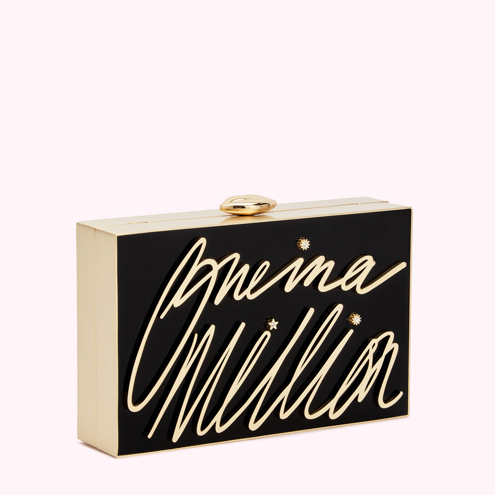 Black and gold Lulu Guinness clutch with "Lulu Guinness" written in gold script and small gold stars.