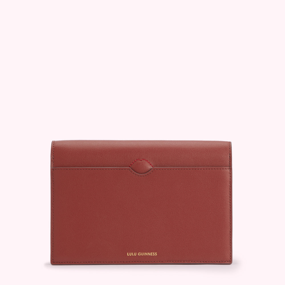 Red leather Lulu Guinness wallet, back view.
