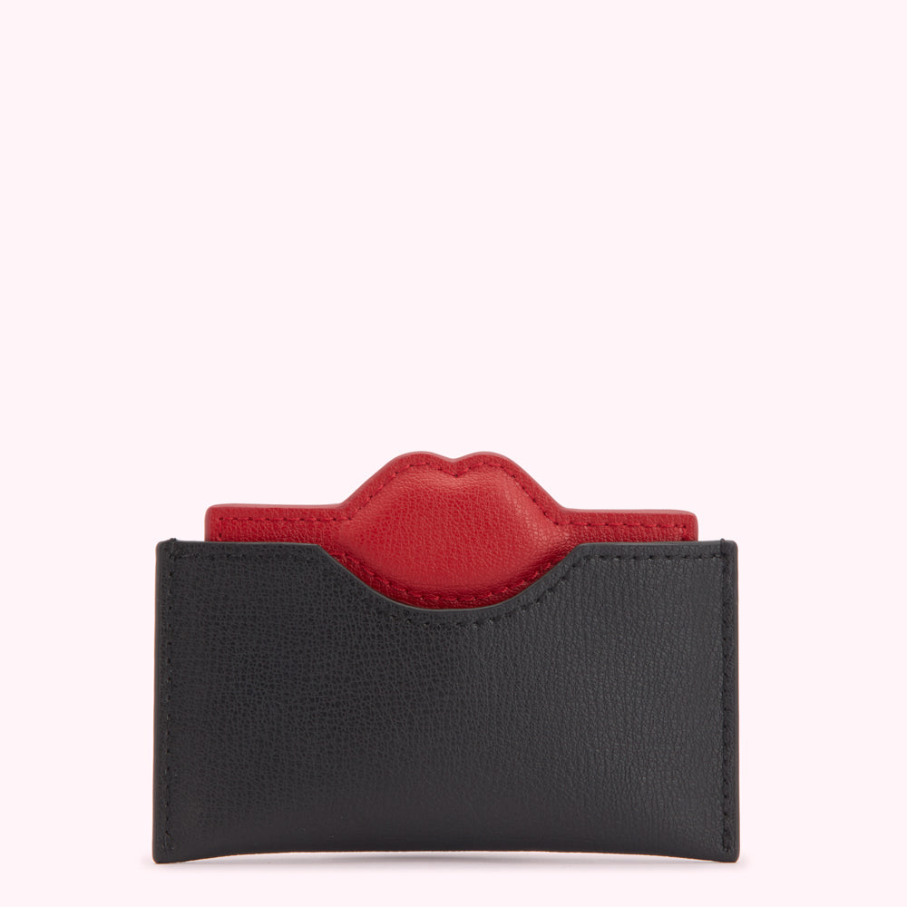 Black leather card holder with a red lip detail.
