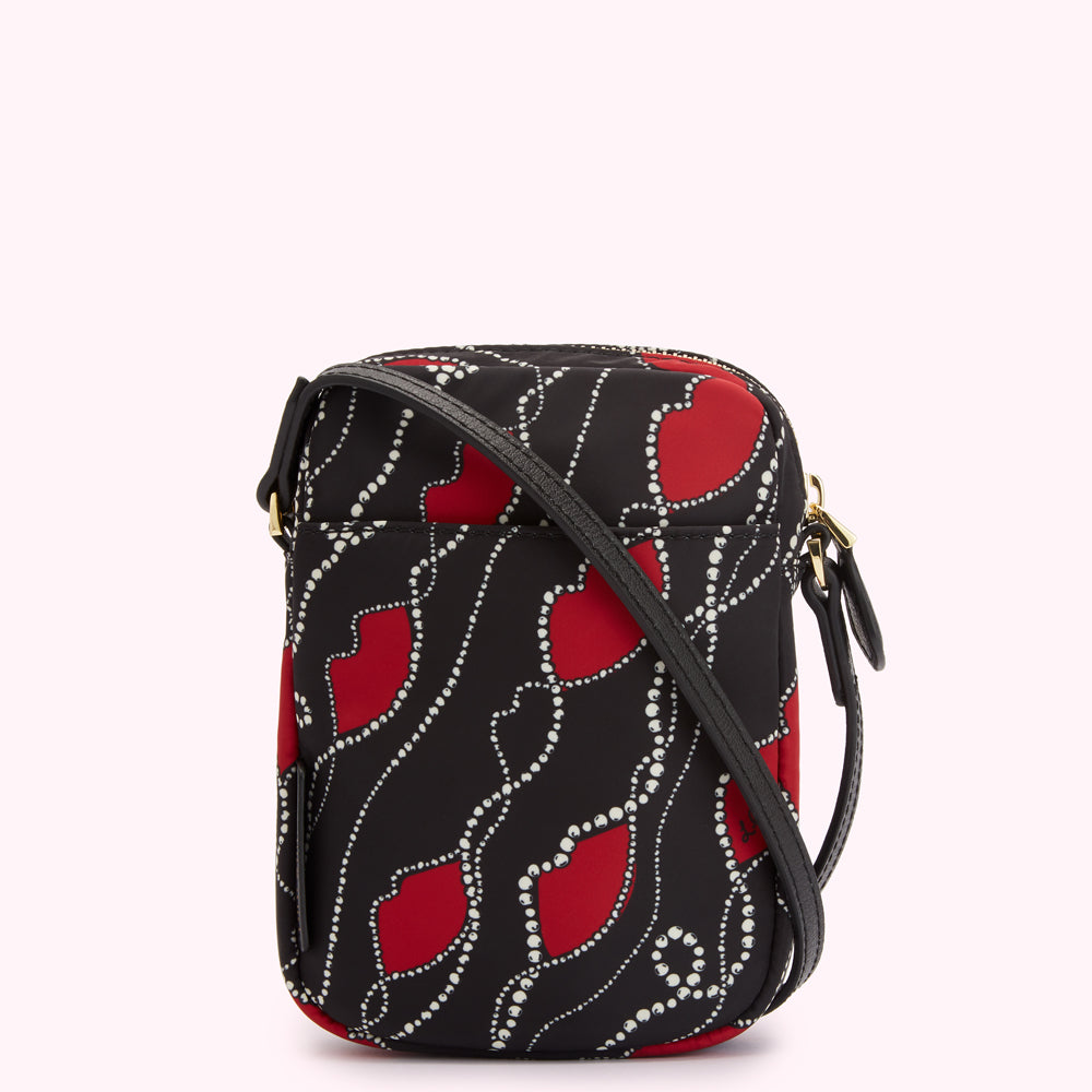Black crossbody bag with red lips and pearl pattern.