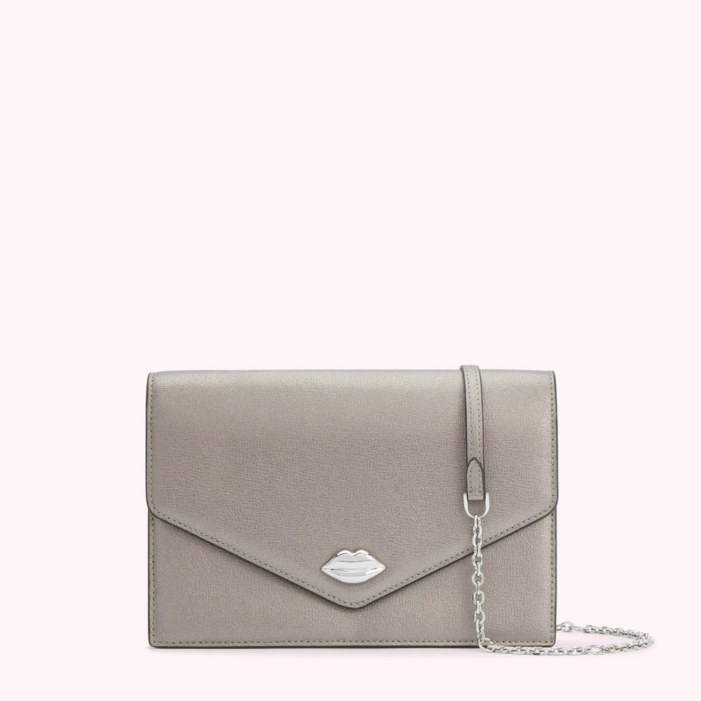 Silver metallic clutch with a silver lip detail and a thin silver chain strap against a white background.
