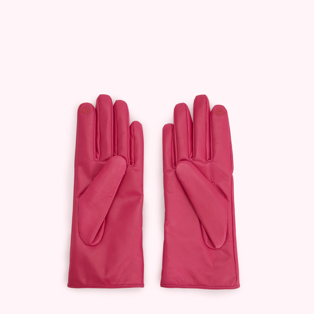 Pair of pink leather gloves on a white background.
