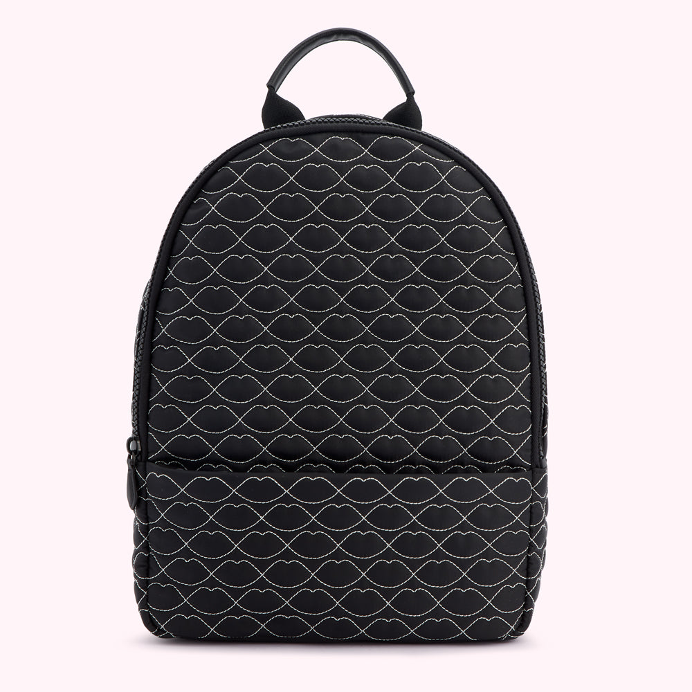 Black quilted backpack with a repeating lip print.