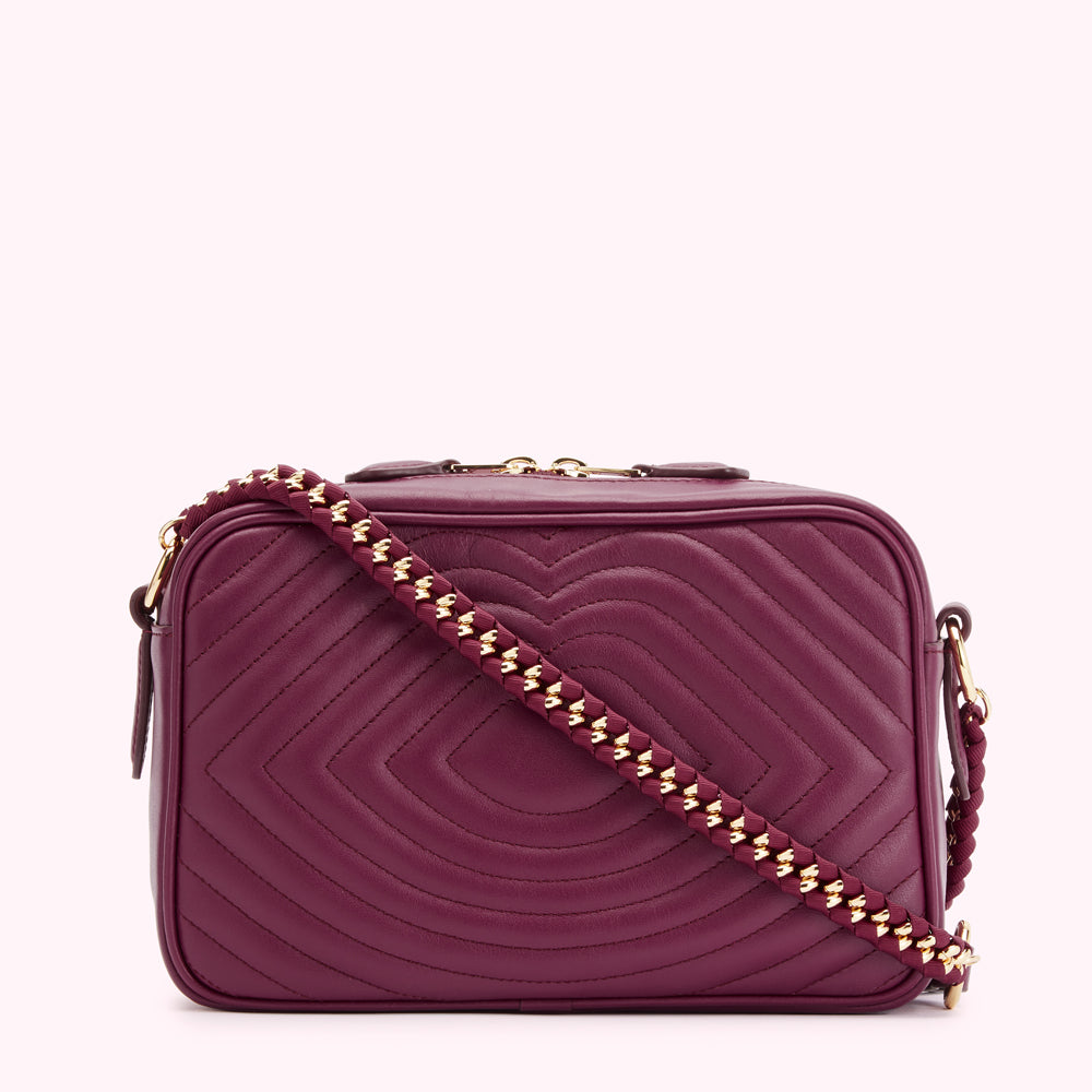 Burgundy quilted leather crossbody bag with gold chain strap.
