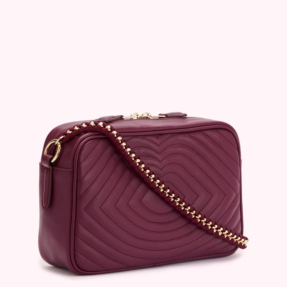 Burgundy quilted crossbody bag with gold chain strap.
