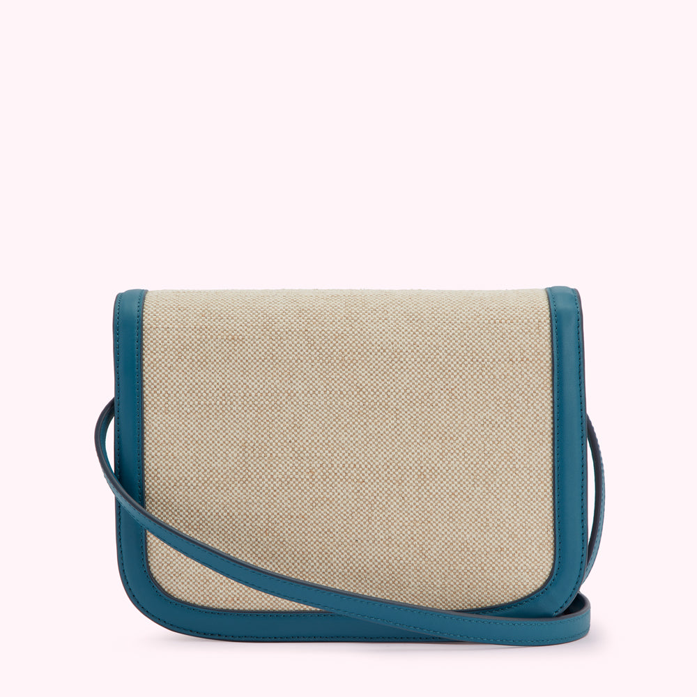 Beige crossbody bag with teal trim and strap.
