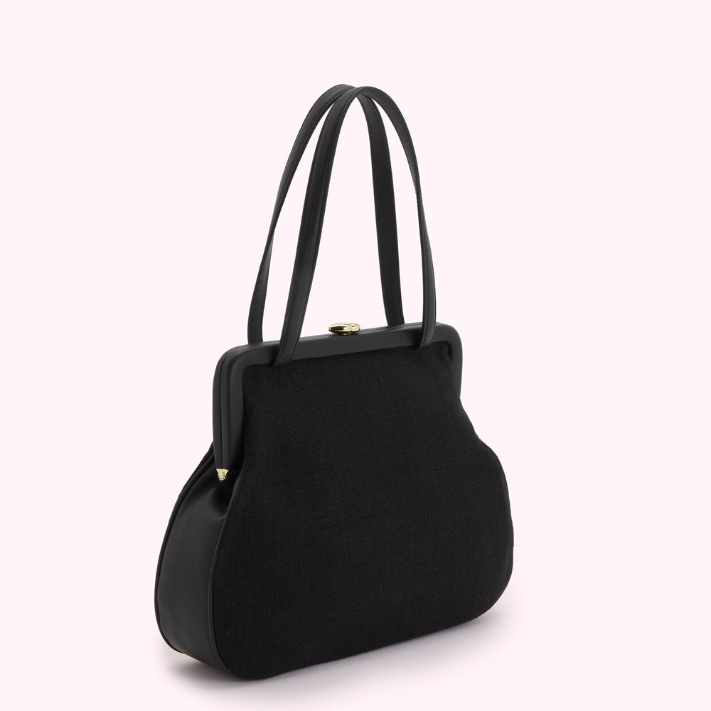 Black handbag with black leather handles and gold clasp.
