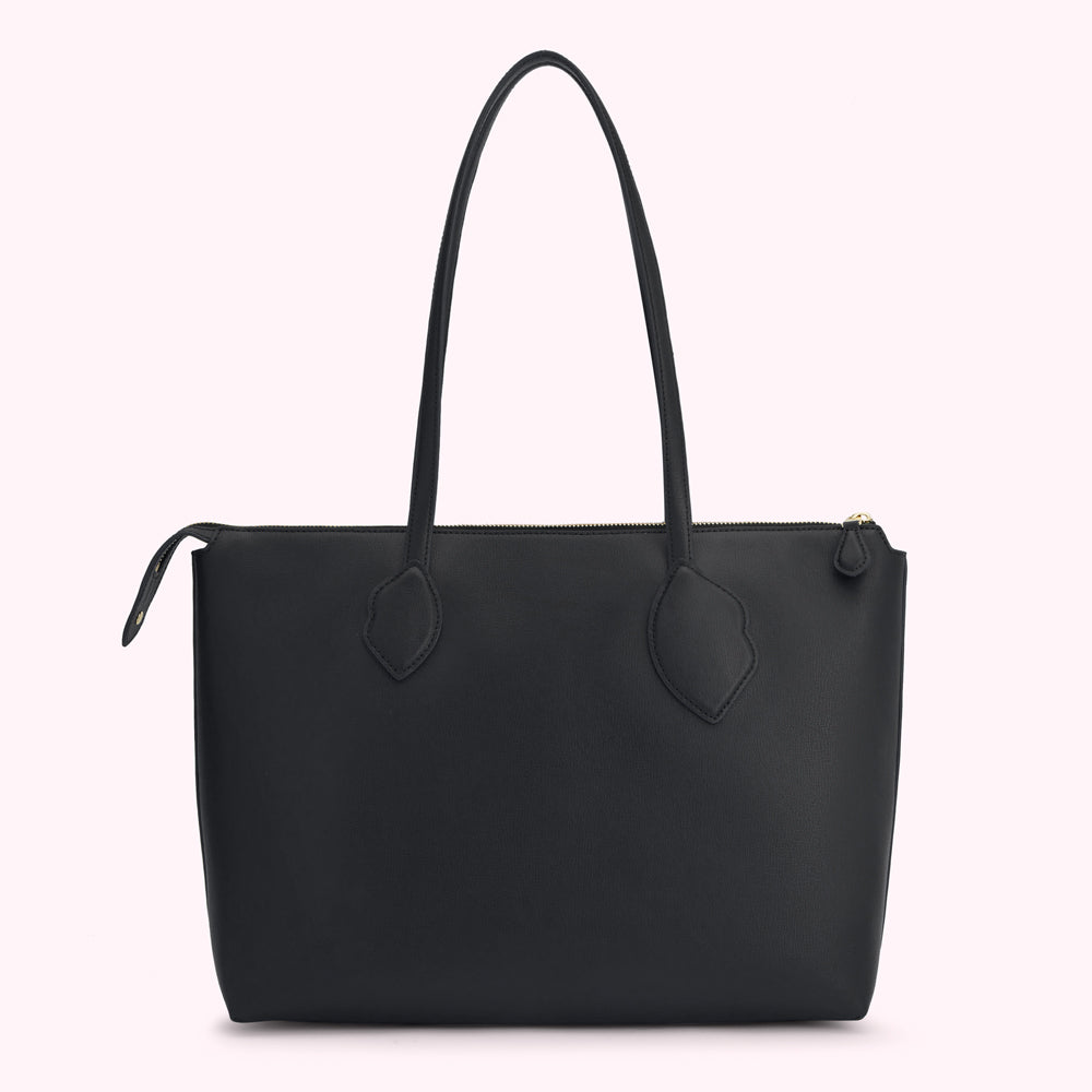 Black leather tote bag with gold zipper and handles.
