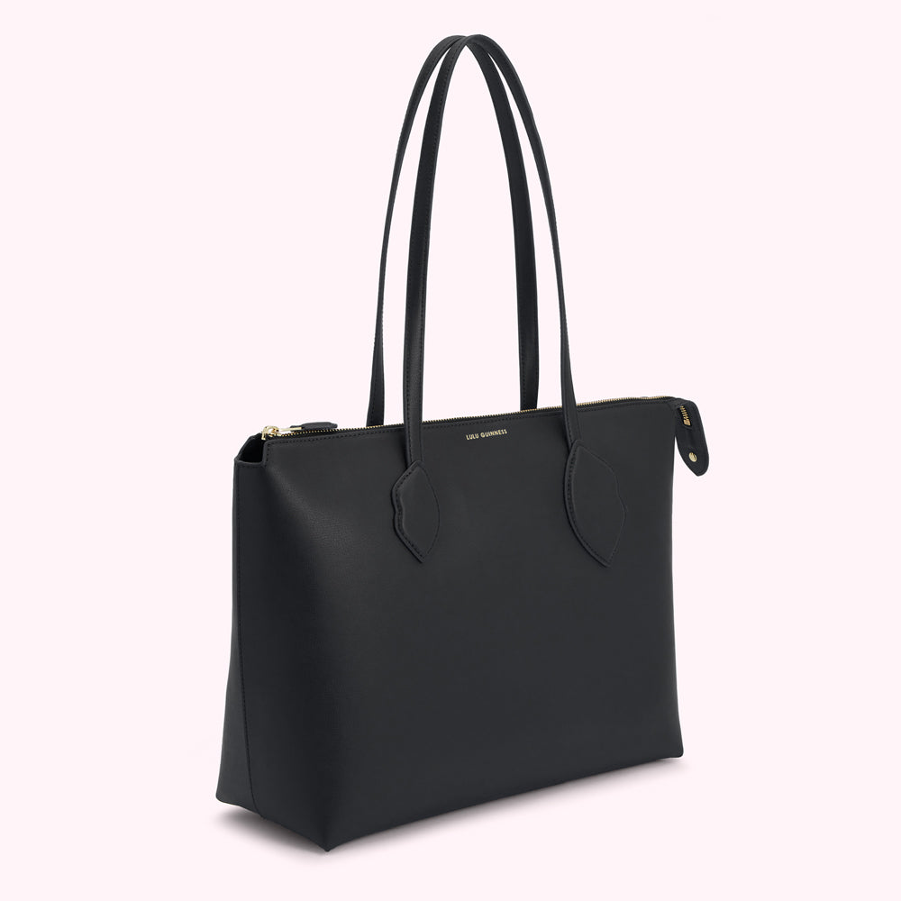 Black Lulu Guinness tote bag with gold zipper and logo.
