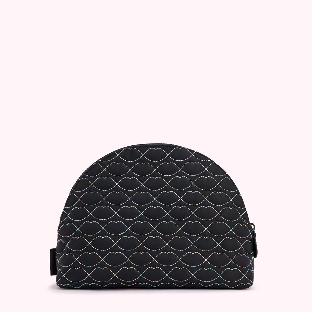 Black quilted makeup bag with a white lip print.
