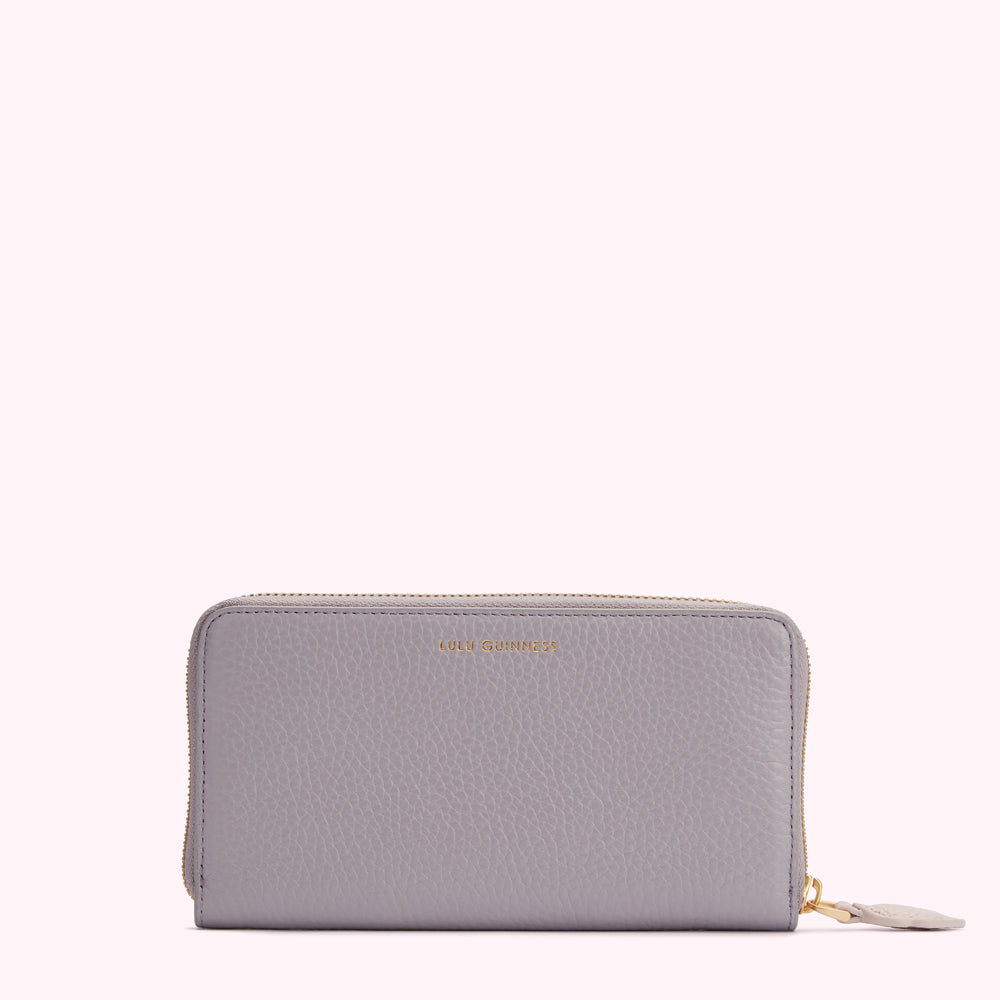 Lilac Lulu Guinness zip-around wallet.