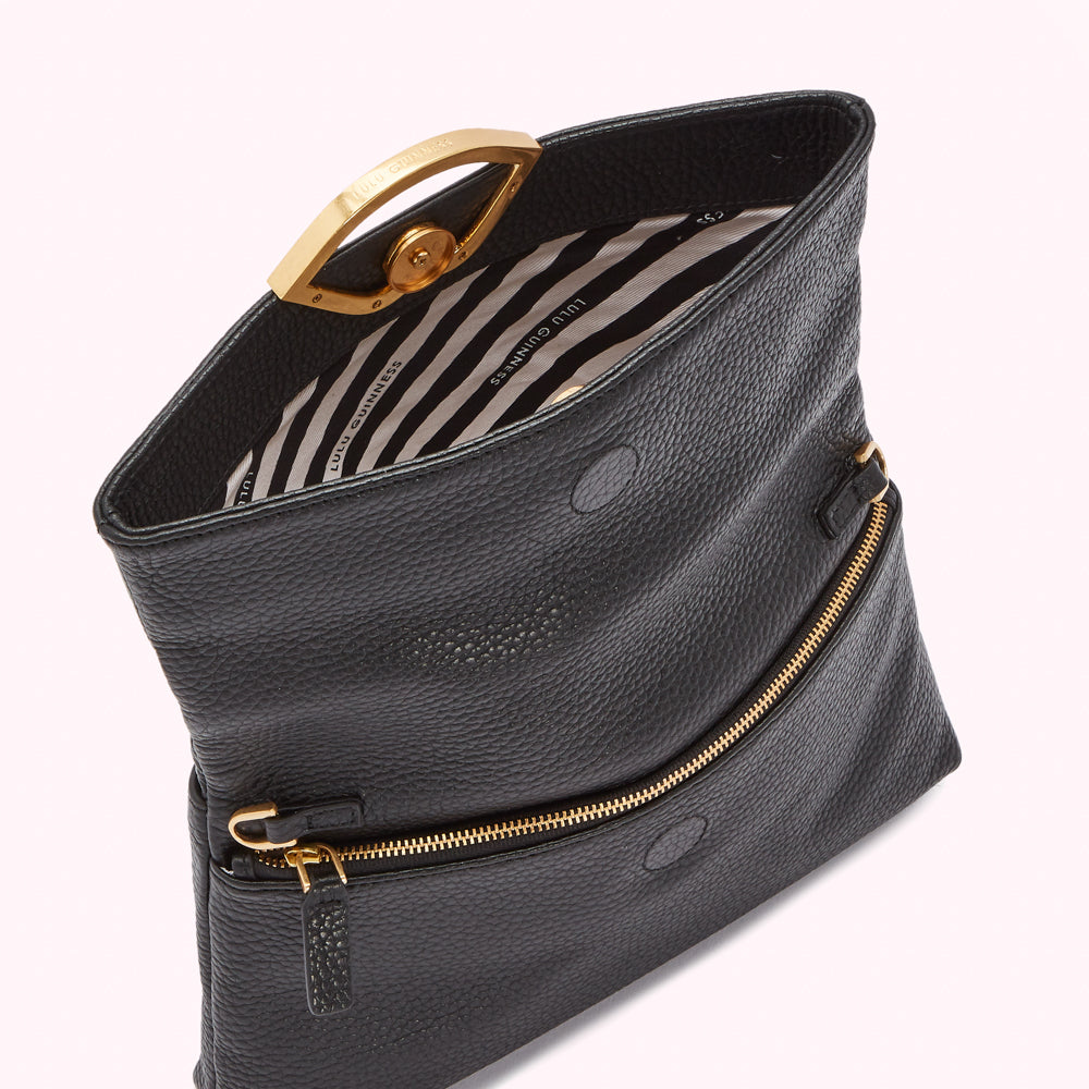 Black leather Lulu Guinness crossbody bag with gold clasp and zipper.
