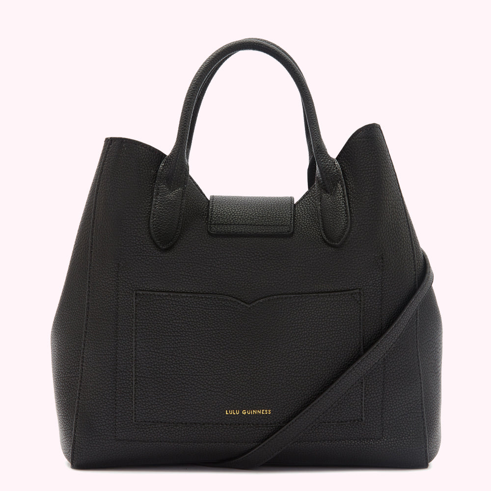 Black Lulu Guinness tote bag with a shoulder strap and small front pocket, shown from the back.
