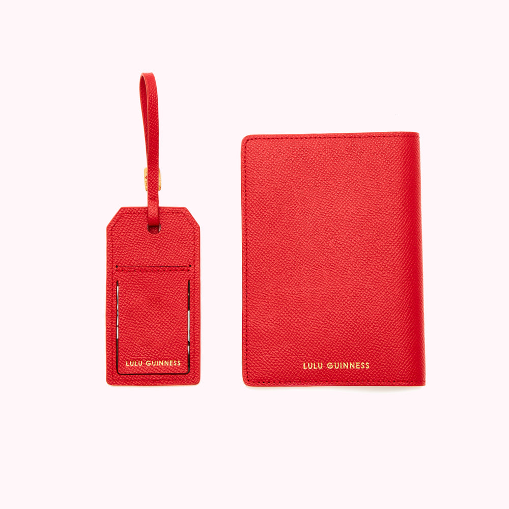 Red luggage tag and passport holder by Lulu Guinness.
