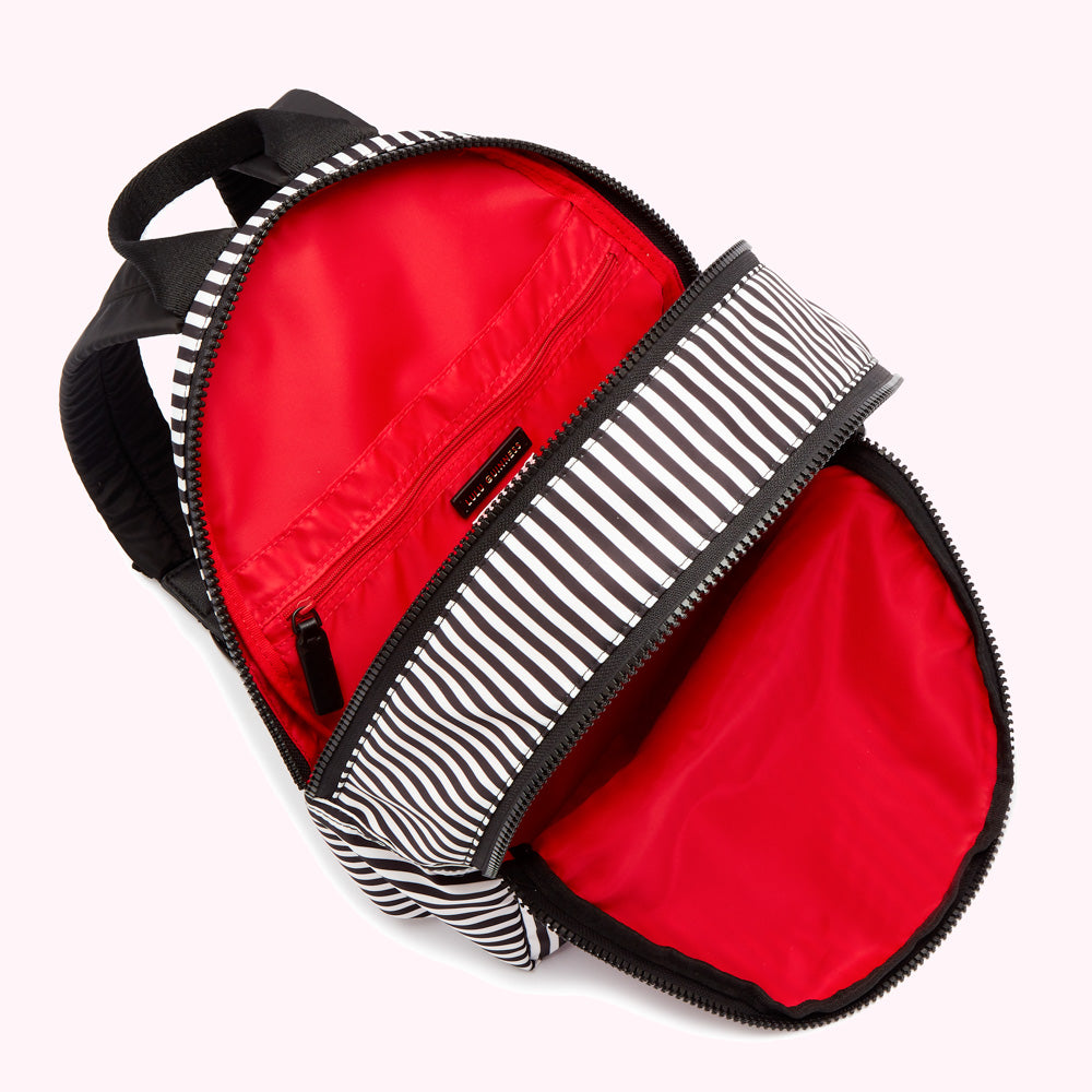 Black and white striped backpack with red interior lining.