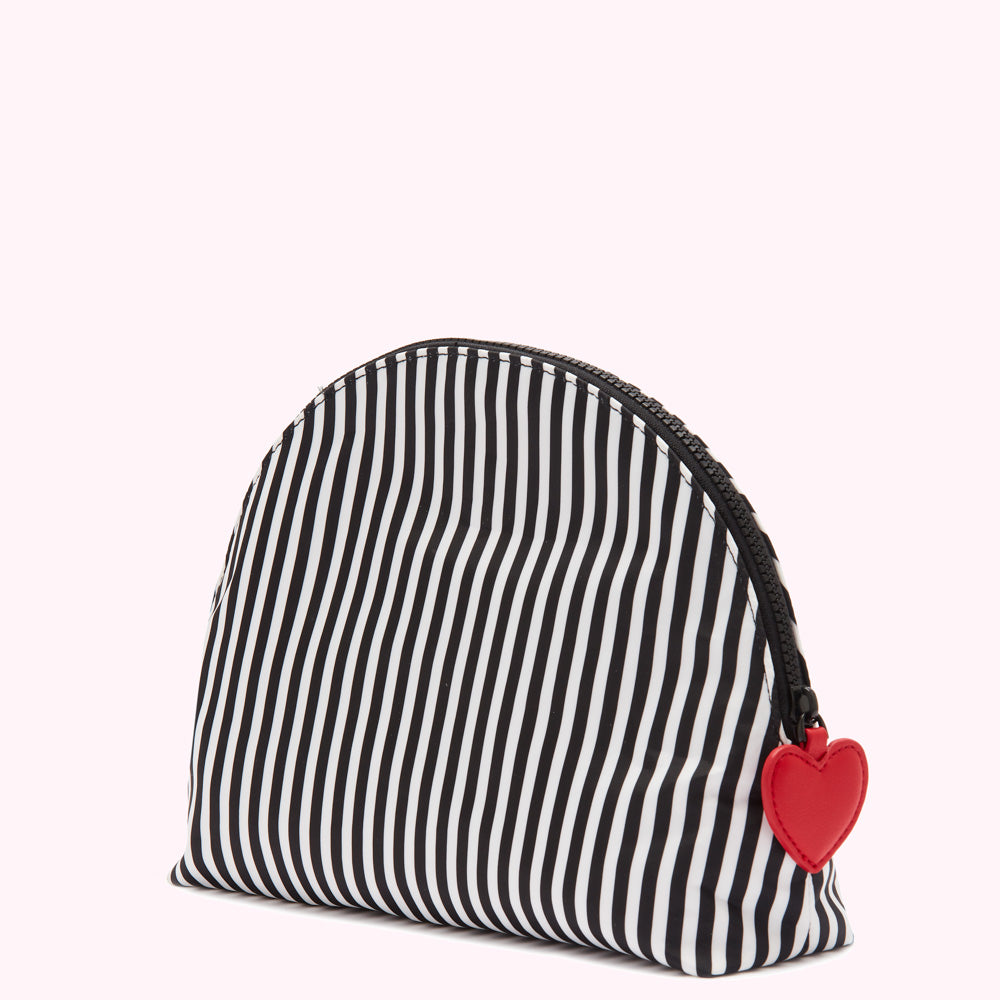 Black and white striped half-moon shaped cosmetic bag with a red heart zipper pull.
