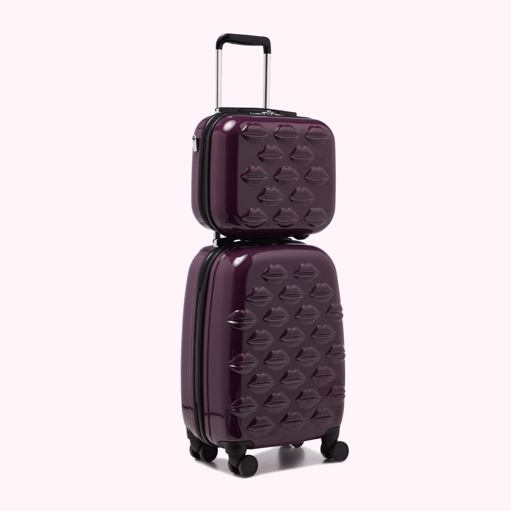 Purple two-piece rolling suitcase decorated with lip prints.
