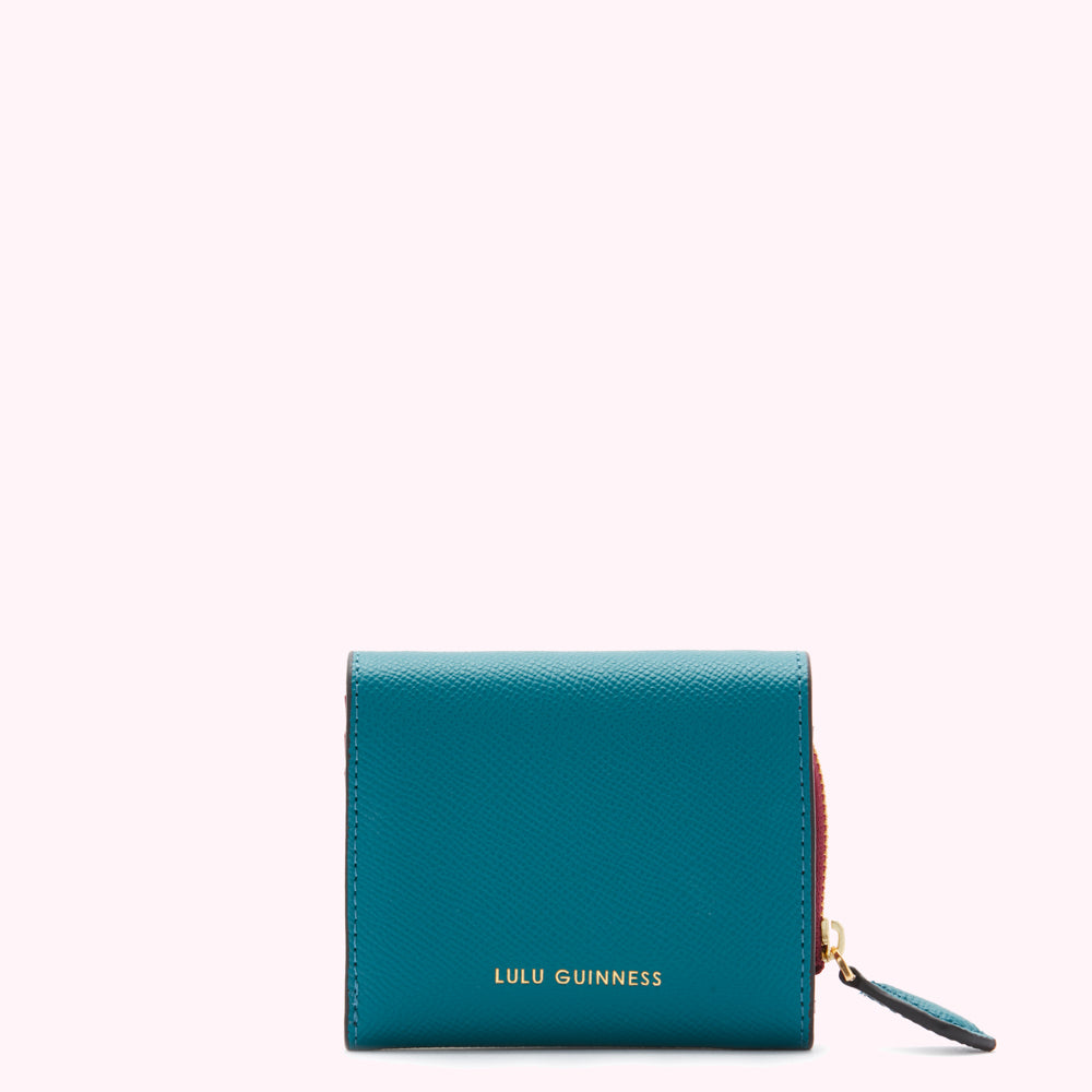 Teal Lulu Guinness zip-around wallet on white background.