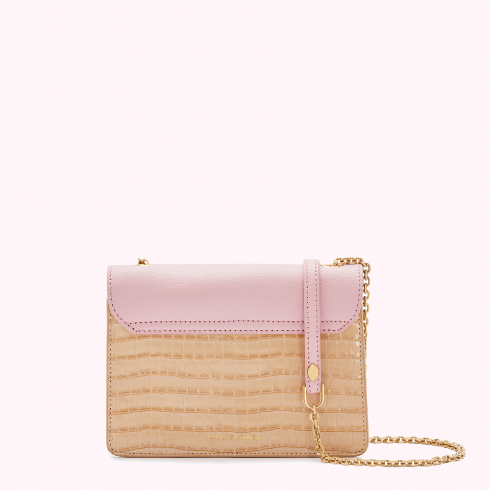 Pink and beige two-toned crossbody bag with gold chain strap.
