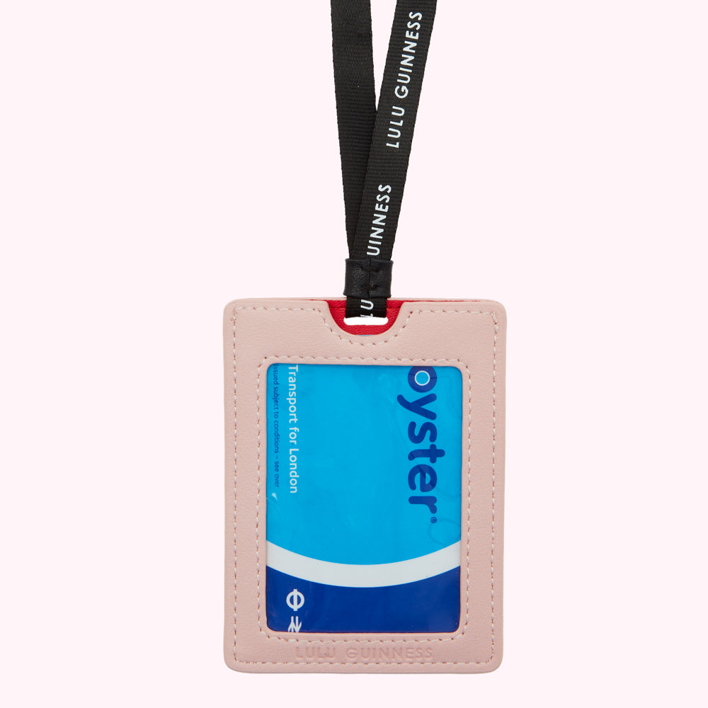 Pink Lulu Guinness Oyster card holder with black lanyard.