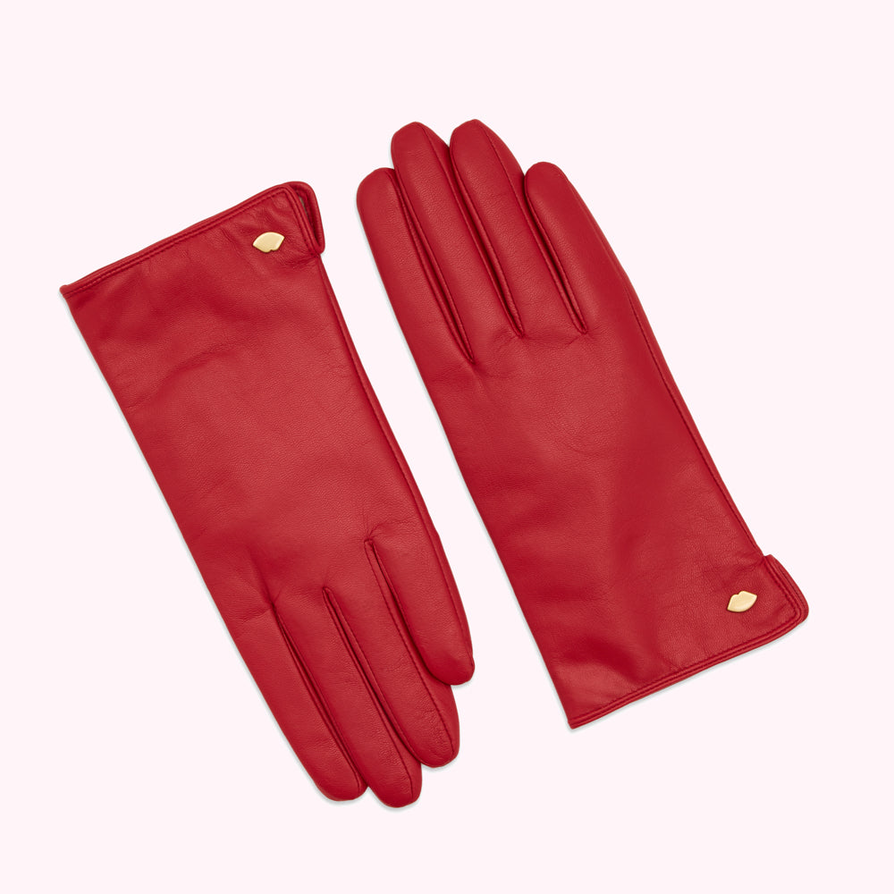Pair of red leather gloves with gold accents.