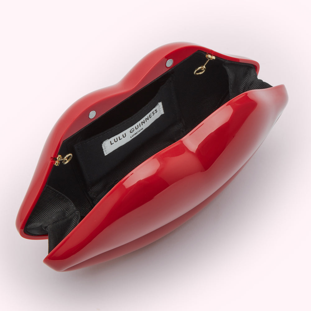 Open red Lulu Guinness lip-shaped clutch.