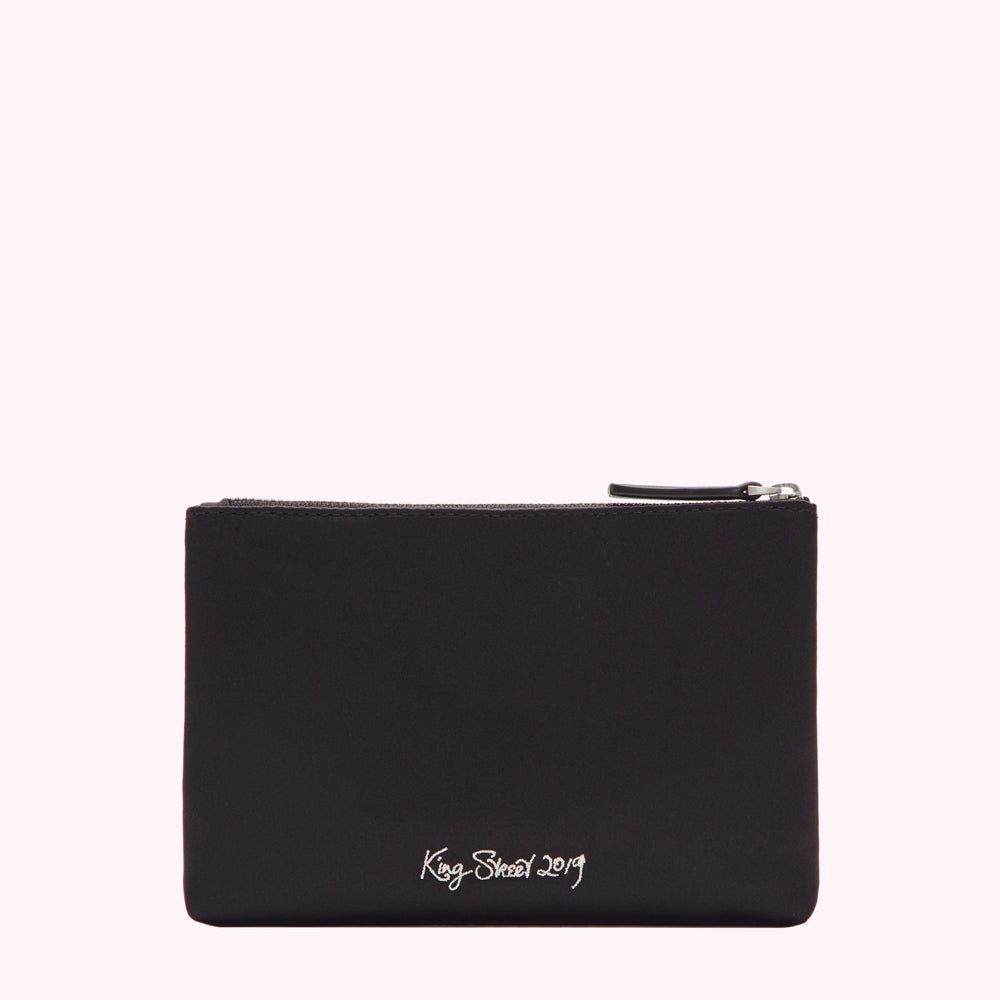 Black zipper pouch with "King Street 2019" embroidered in white.
