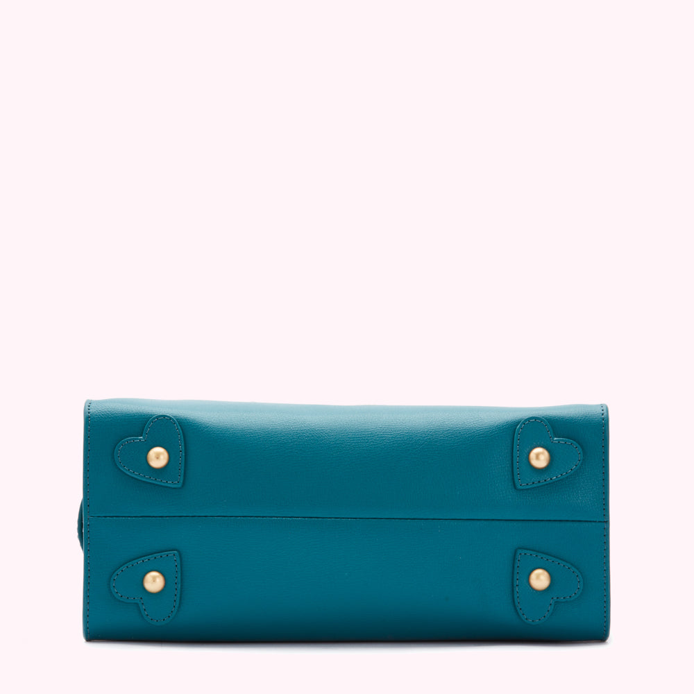 Teal leather handbag with gold heart accents.
