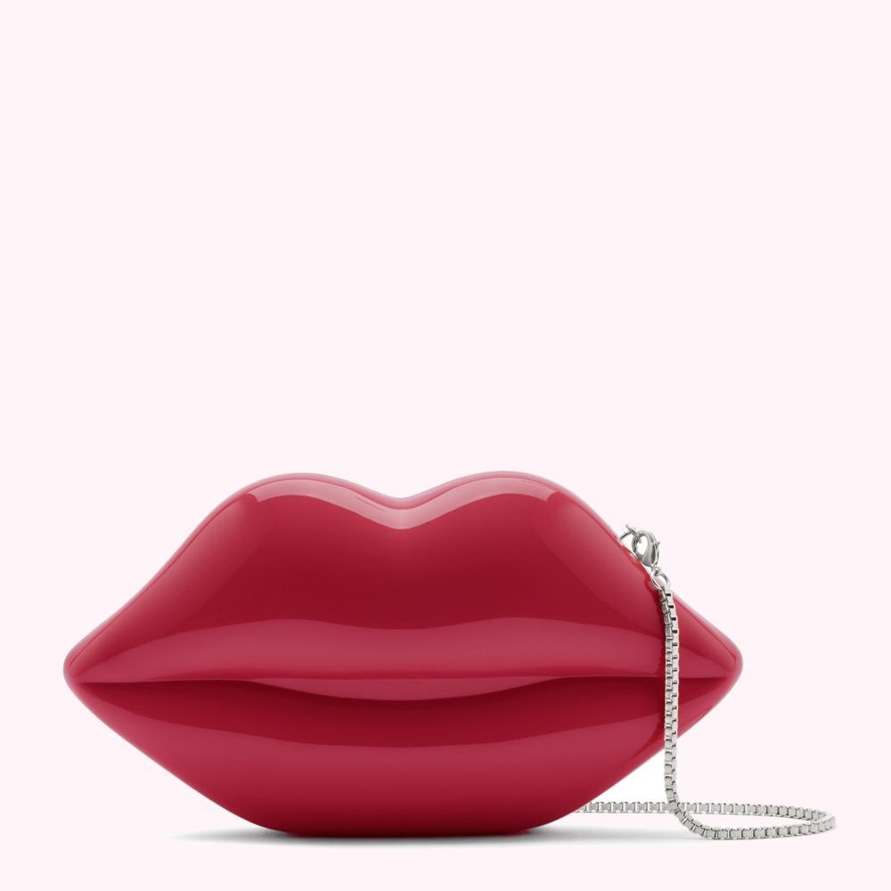 Red lip-shaped clutch with a silver chain strap.
