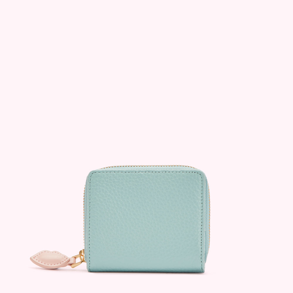 Light blue leather zip-around wallet with pink heart zipper pull.
