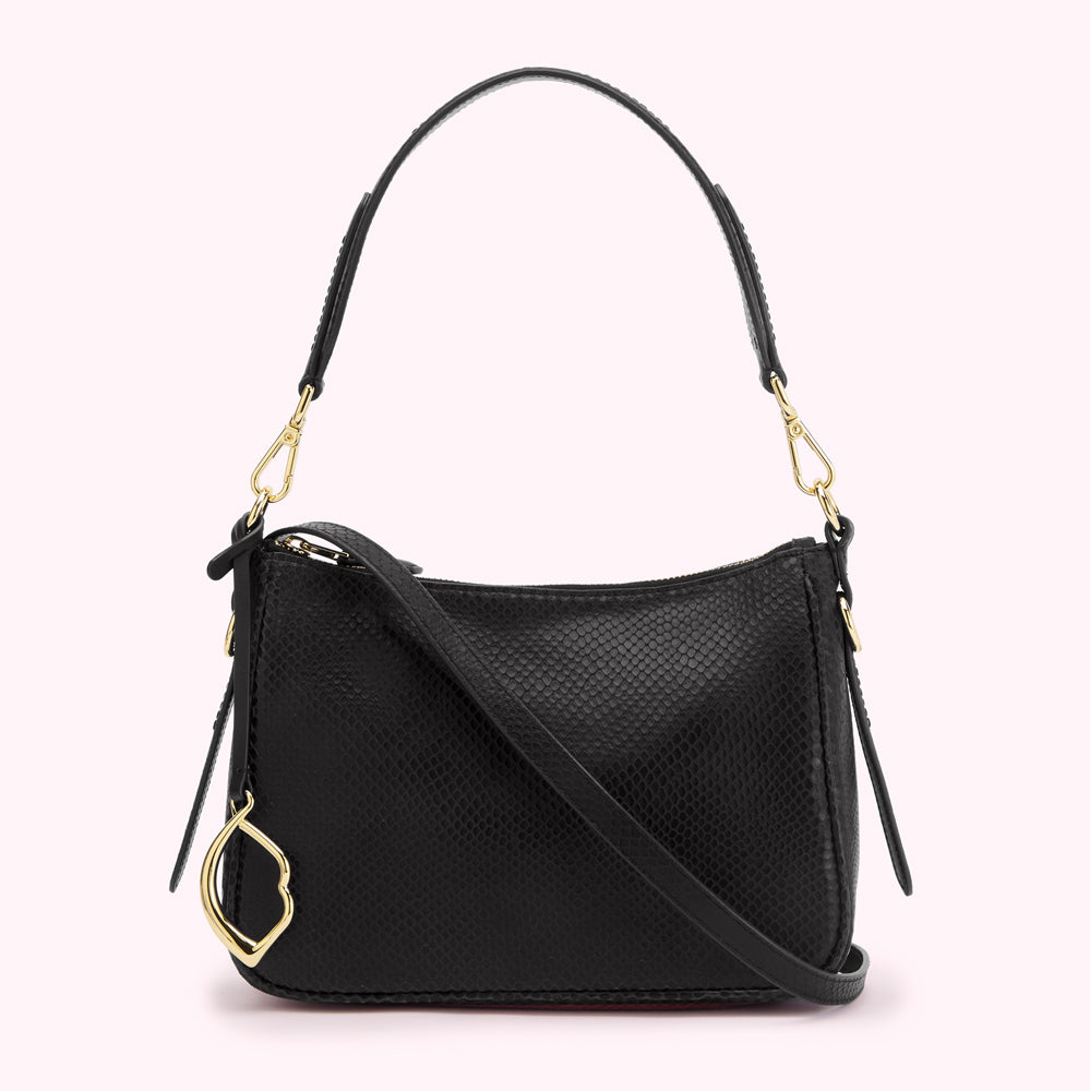 Black snakeskin-textured shoulder bag with gold hardware and adjustable strap.
