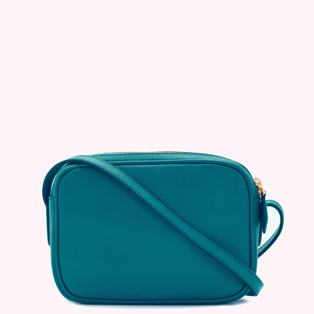 Teal rectangular crossbody bag with a gold zipper.
