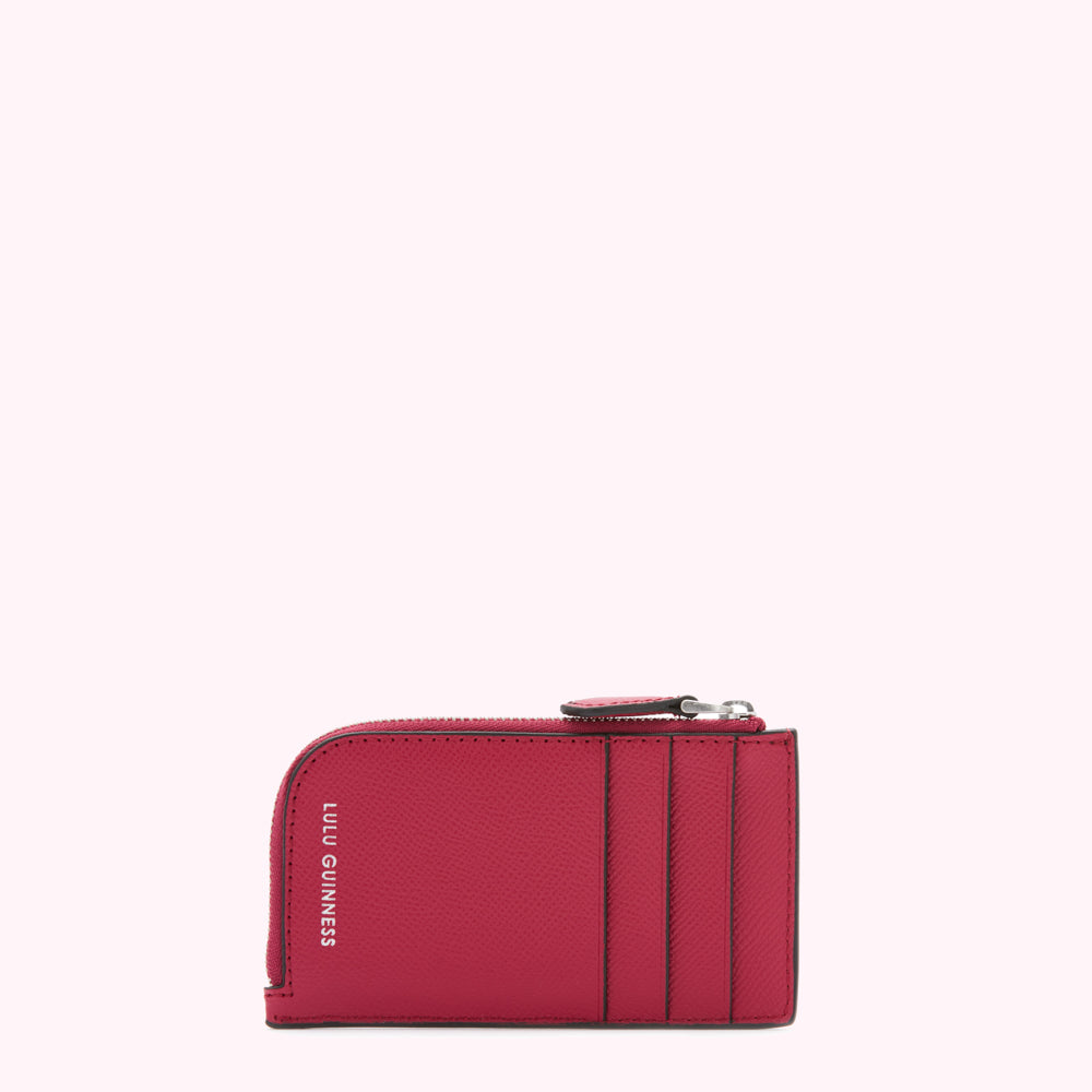 Red Lulu Guinness zip-around cardholder against a white background.
