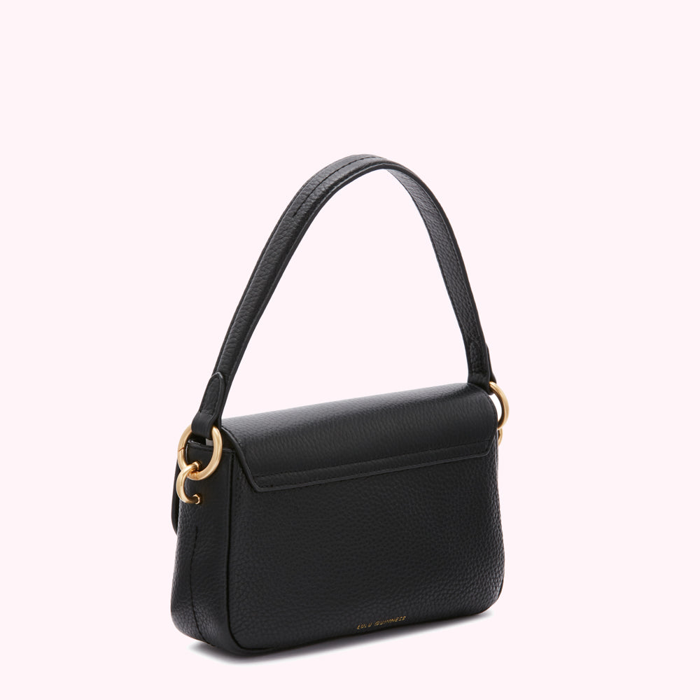 Black Lulu Guinness crossbody bag with gold-toned hardware, shown from the back.
