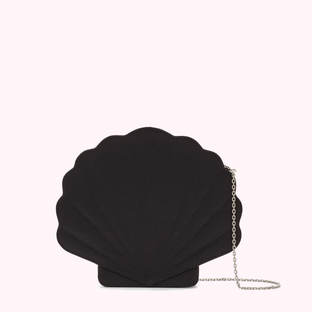 Black scallop-shaped crossbody bag with a silver chain strap against a white background.

