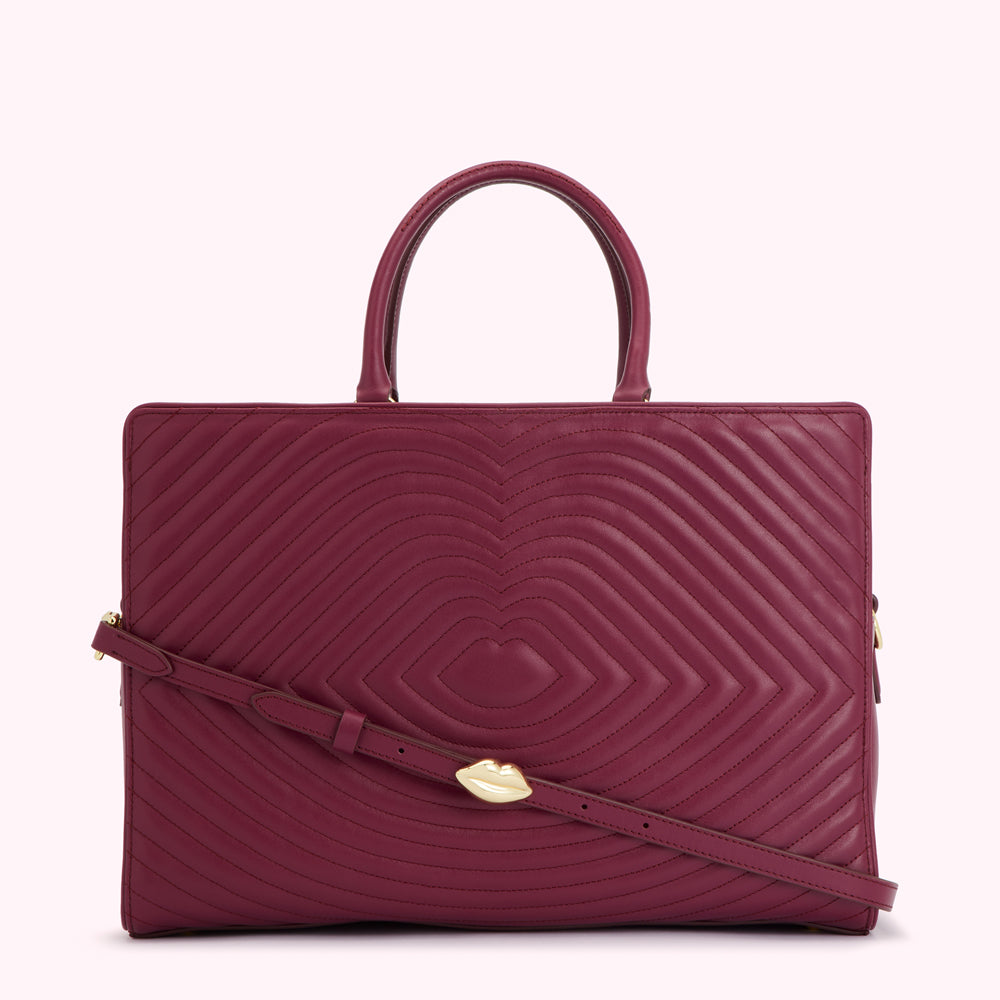 Burgundy quilted leather tote bag with gold lip detail.
