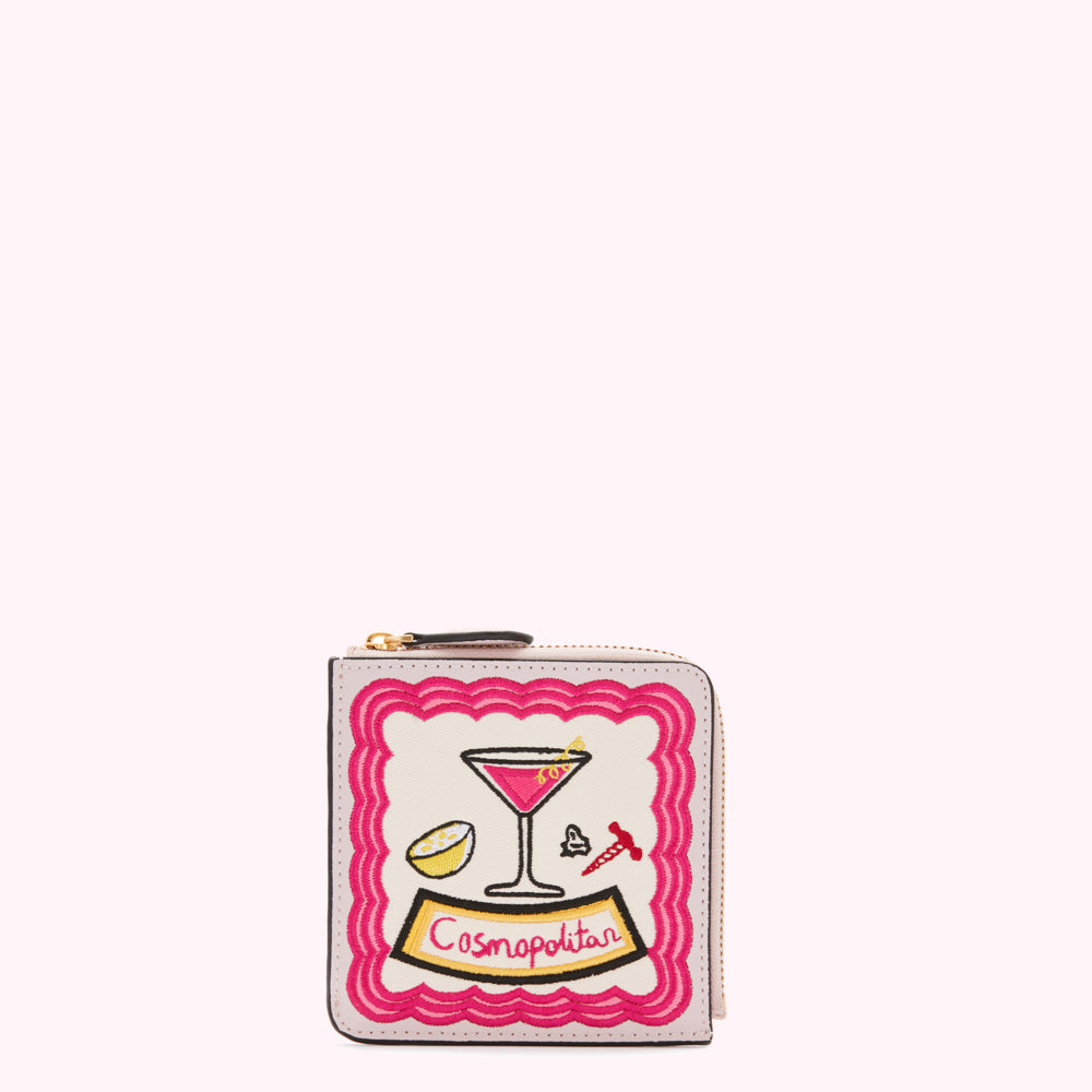 Pale pink leather zip-around wallet with embroidered Cosmopolitan cocktail design.